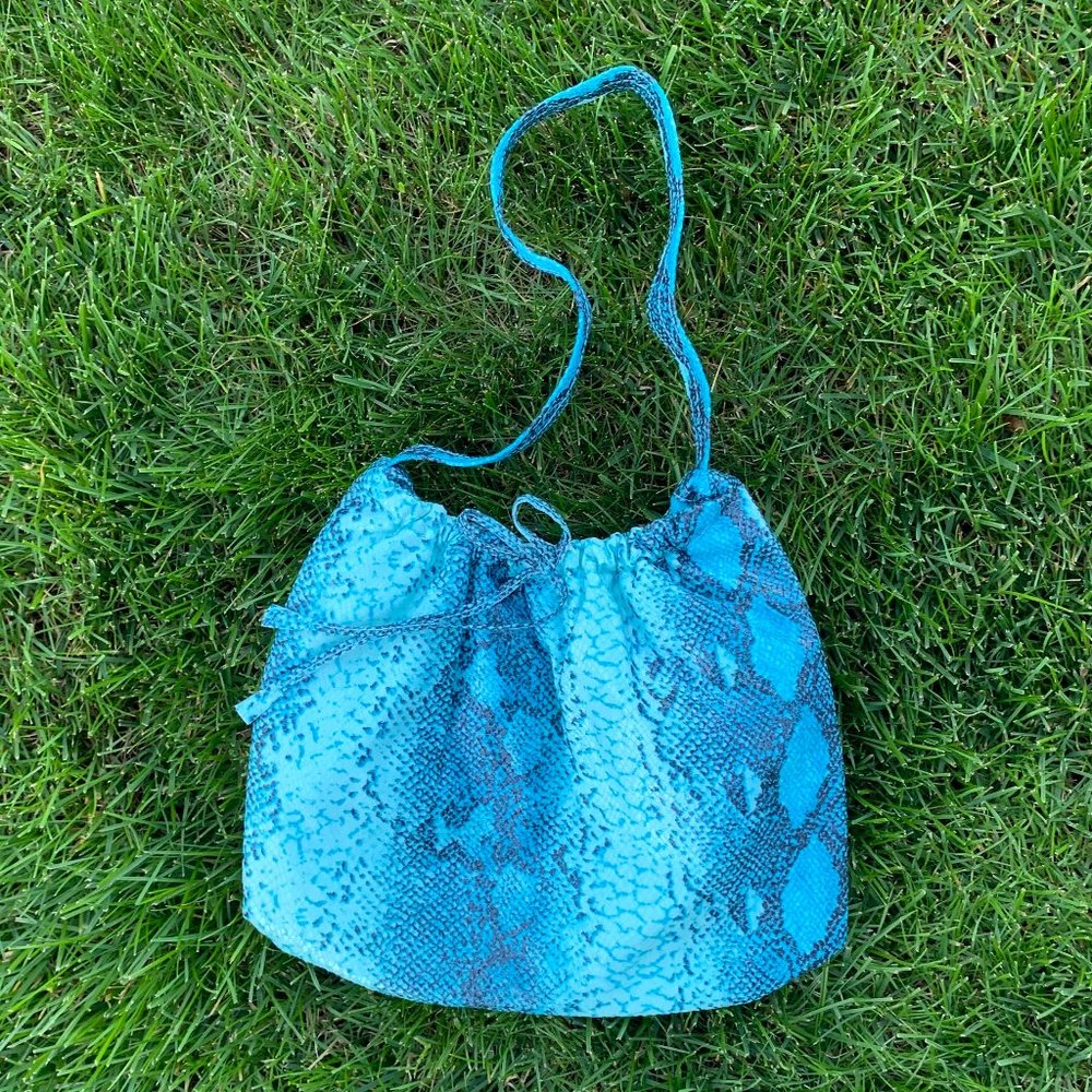 NWOT faux snakeskin teal & black pouch bag.